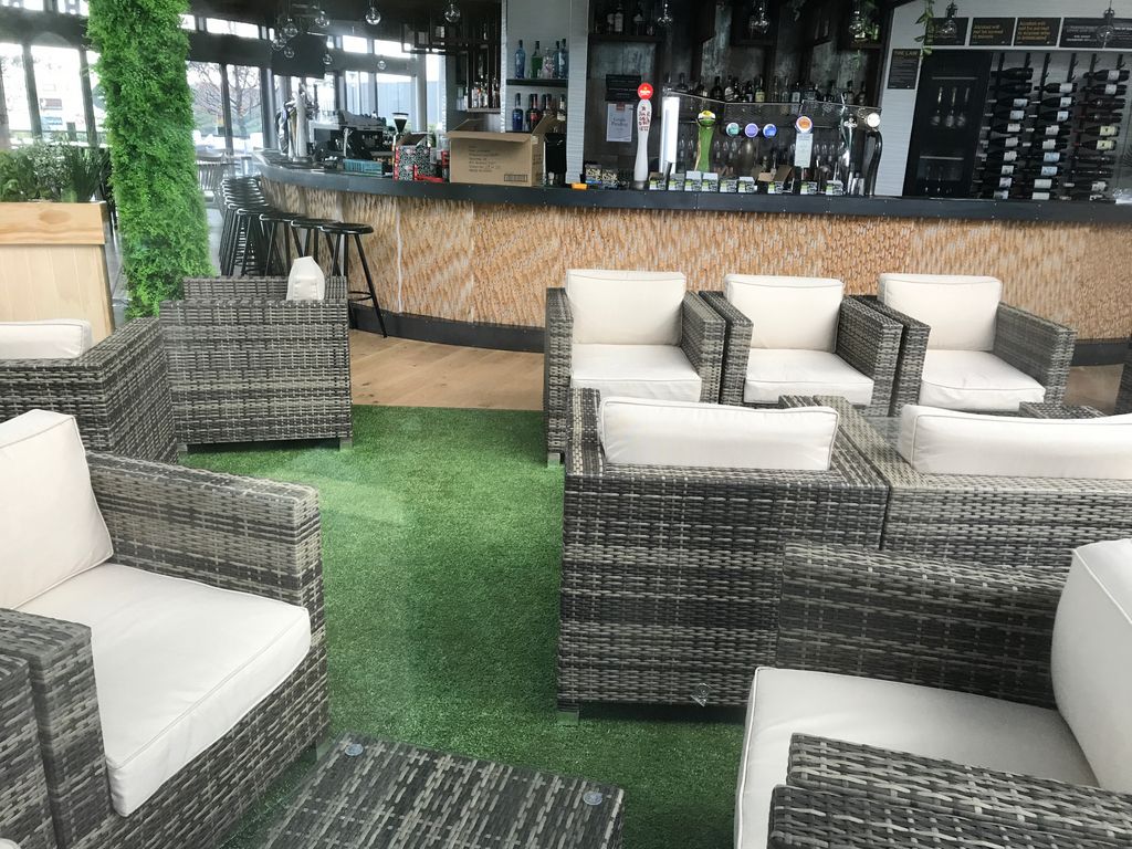 Indoor bar area with artificial grass