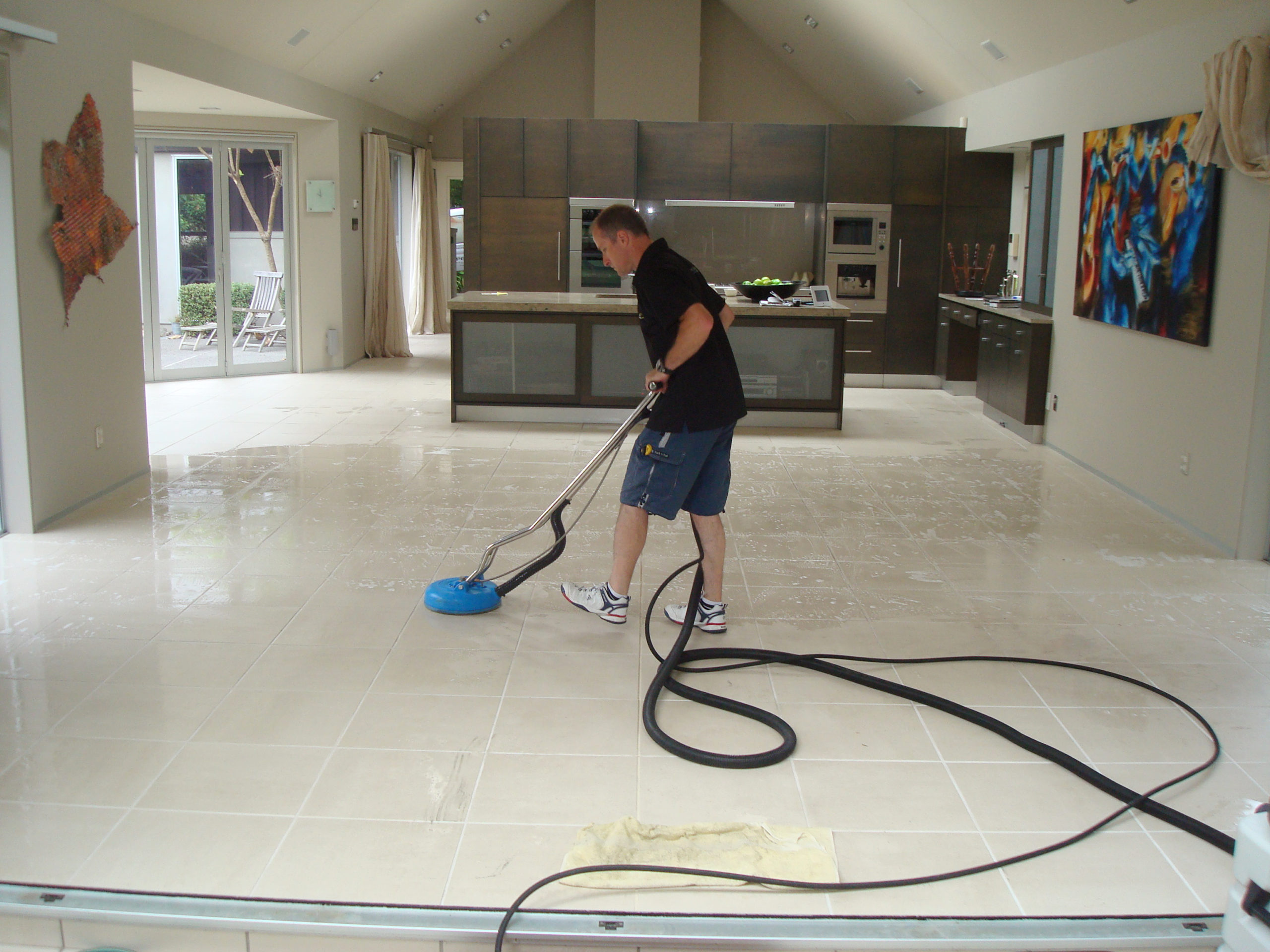 Franchise member cleaning tiles