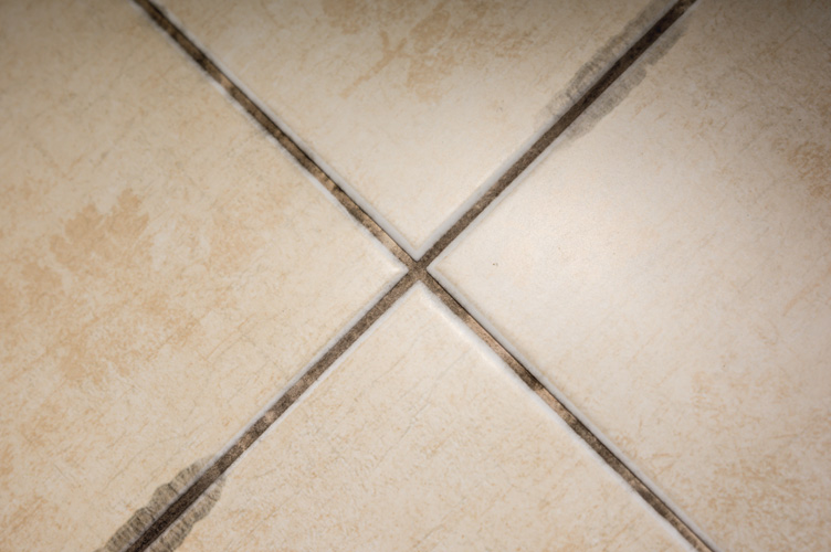Discoloured tiles before - Dirty grout