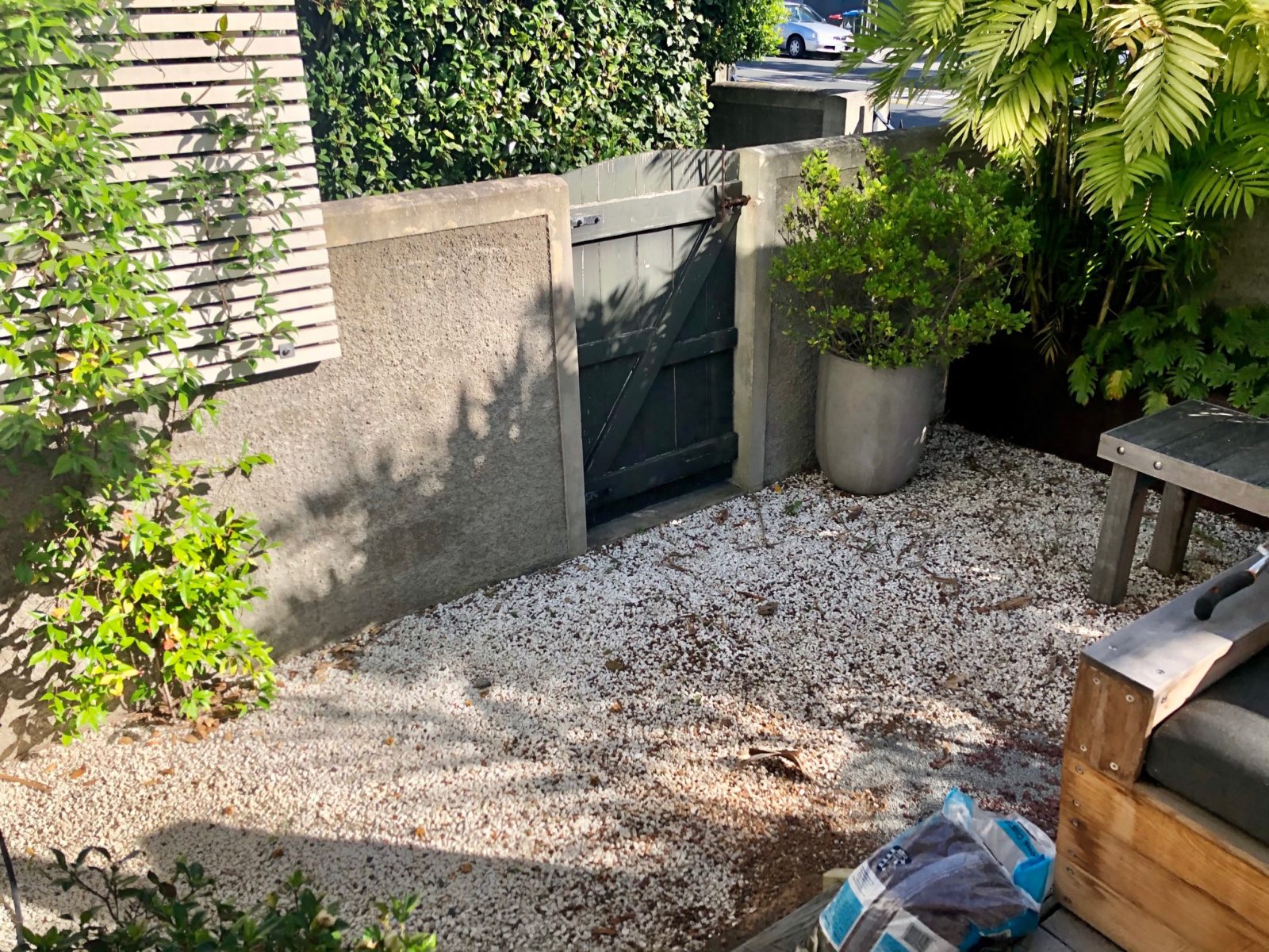 GrassPro artificial grass transforms a small yard into a chic entertaining space