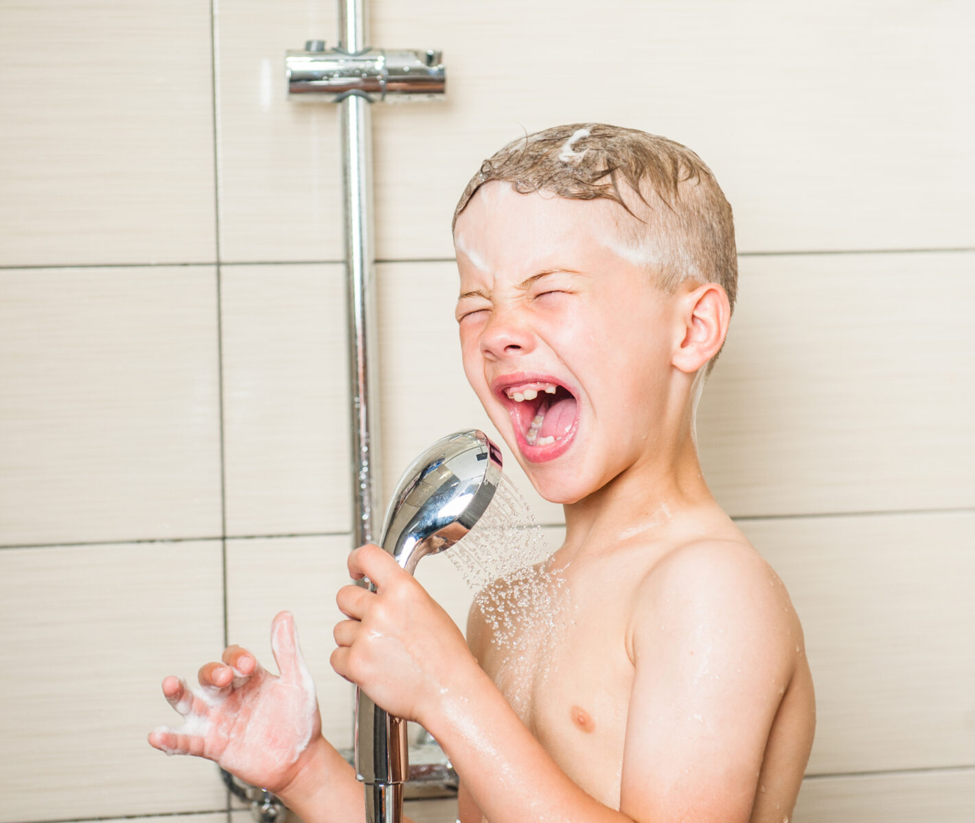 Kid having a shower