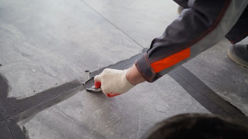 Tiles being regrouted