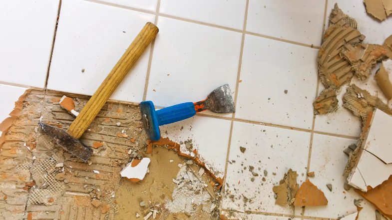cracked tiles with tools lying on top